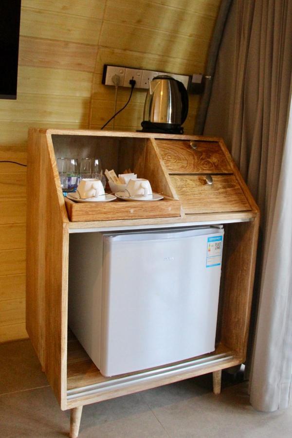 Nivadoo Resort Sigiriya Exterior photo A small refrigerator in a hotel room
