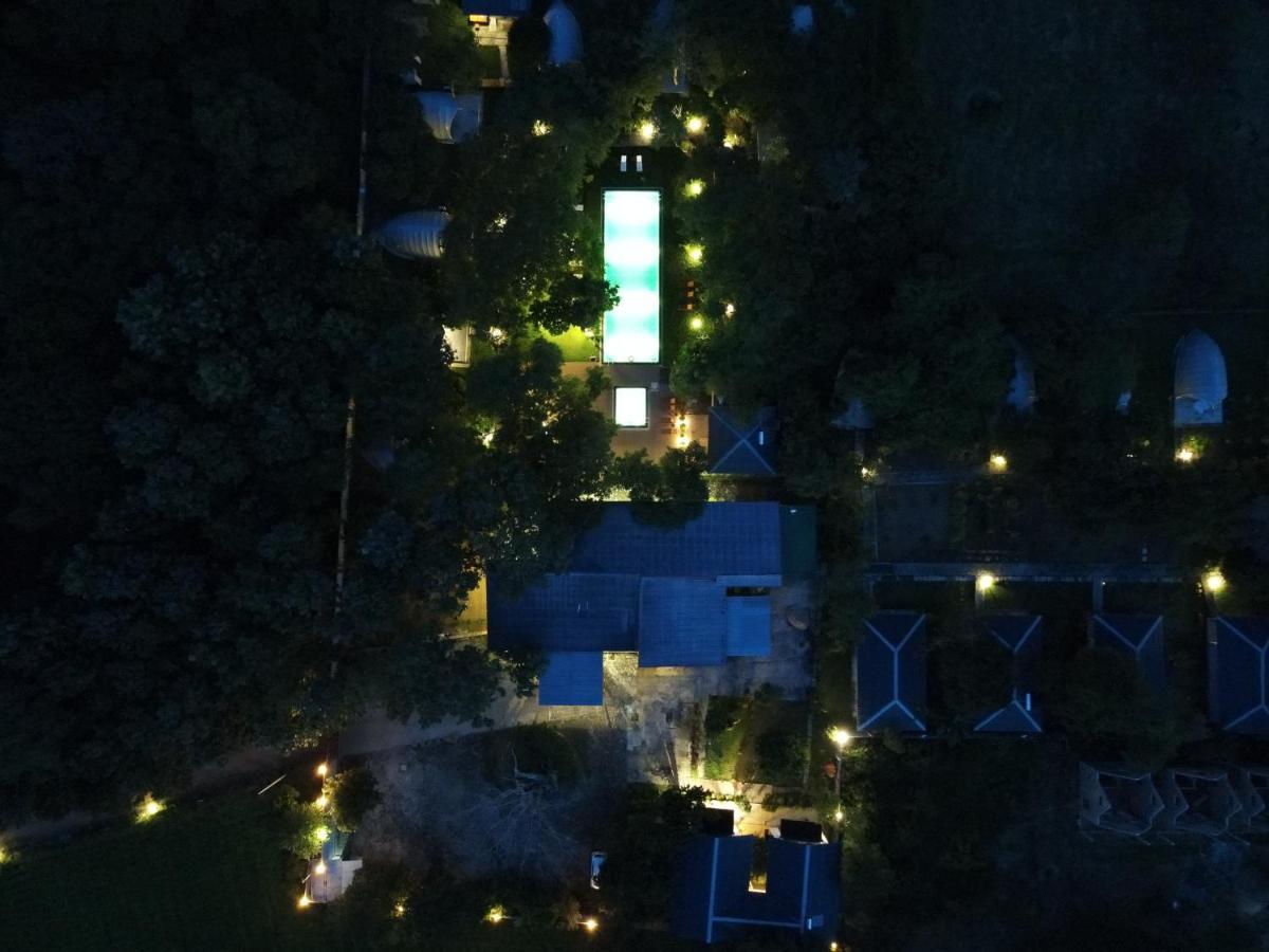 Nivadoo Resort Sigiriya Exterior photo Aerial view of the house at night